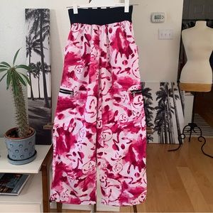 Zumba Wear pants in white and pink abstract print.  Cargo style with 6 pockets.
